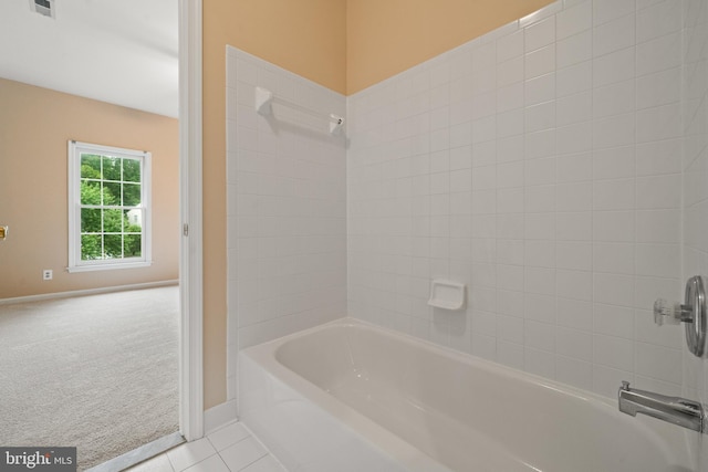 12850 Salmon Run Ct, Manassas, VA 20112 - bathroom featuring shower / bathtub combination, baseboards, and tile patterned floors