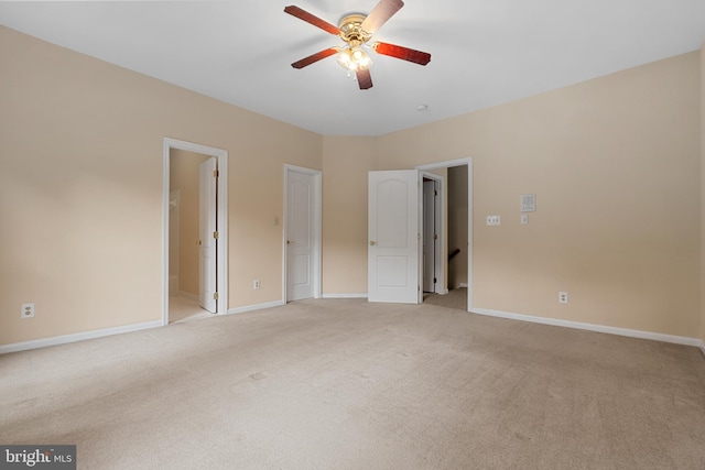 12850 Salmon Run Ct, Manassas, VA 20112 - unfurnished bedroom with baseboards, ensuite bathroom, ceiling fan, and light colored carpet