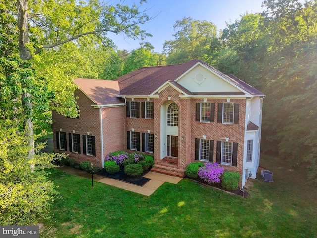12850 Salmon Run Ct, Manassas, VA 20112 - colonial-style house with a front lawn and brick siding