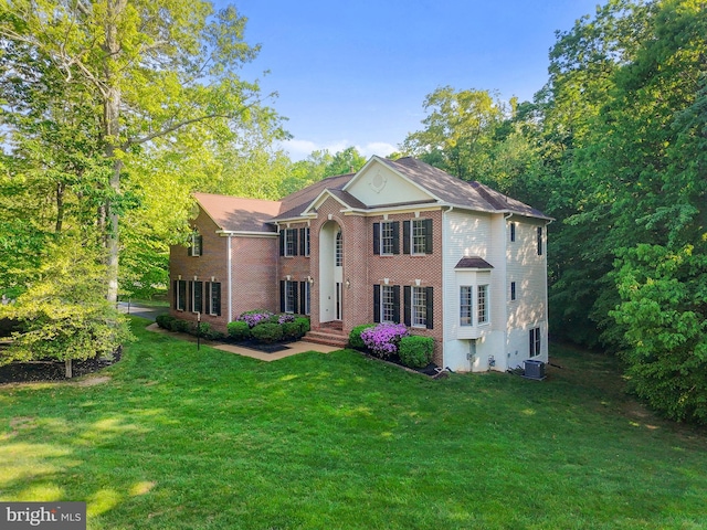 12850 Salmon Run Ct, Manassas, VA 20112 - colonial inspired home featuring a front lawn, brick siding, and cooling unit