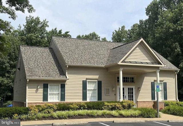 12850 Salmon Run Ct, Manassas, VA 20112 - view of front of house featuring brick siding, a shingled roof, and uncovered parking