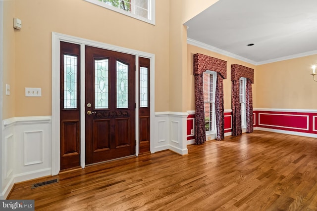 12850 Salmon Run Ct, Manassas, VA 20112 - entryway featuring visible vents, a decorative wall, and wainscoting