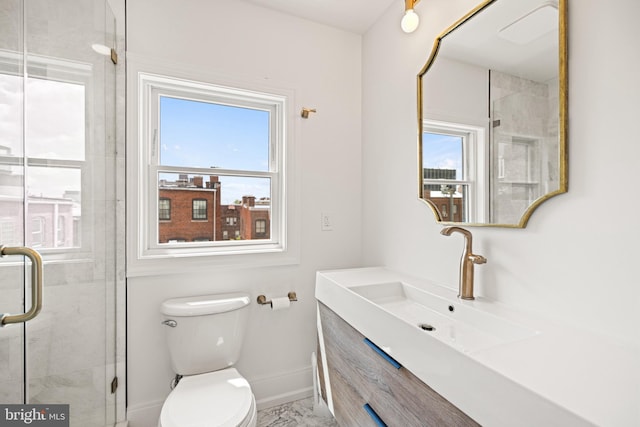 full bathroom with baseboards, plenty of natural light, a shower stall, and toilet