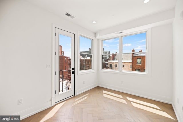 doorway featuring visible vents, recessed lighting, and baseboards