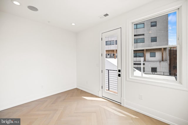 doorway featuring recessed lighting, baseboards, and visible vents