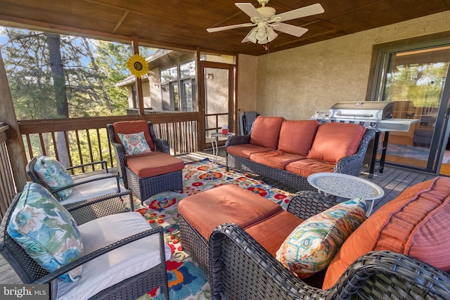 sunroom with a ceiling fan and an outdoor hangout area