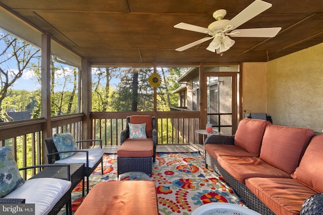 sunroom / solarium featuring ceiling fan and outdoor lounge area
