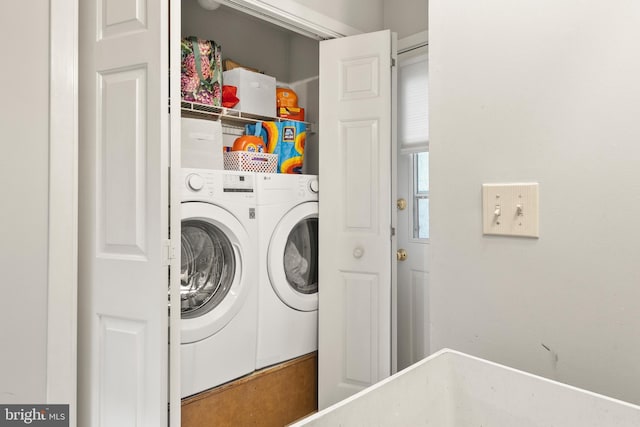laundry room with independent washer and dryer and laundry area