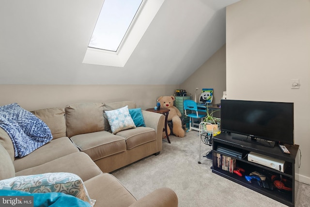 carpeted living area with vaulted ceiling with skylight