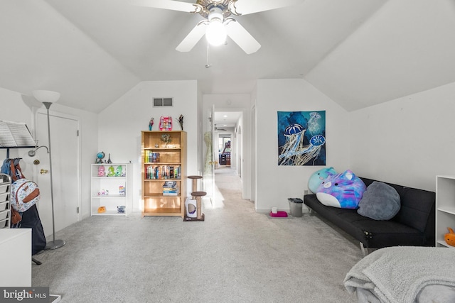 interior space featuring carpet, lofted ceiling, and visible vents