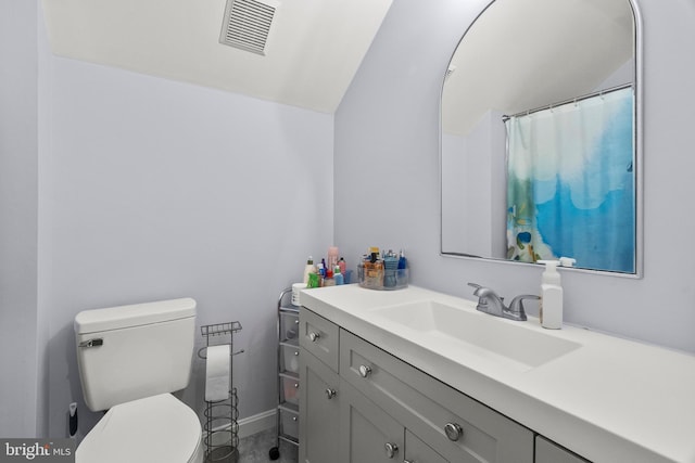 full bathroom with visible vents, vaulted ceiling, vanity, baseboards, and toilet