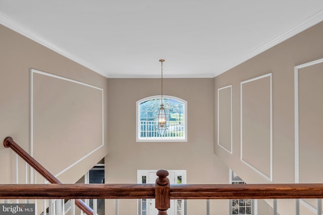 details with crown molding and an inviting chandelier