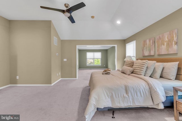 carpeted bedroom featuring visible vents, a ceiling fan, baseboards, and vaulted ceiling