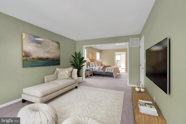 carpeted living room with baseboards and visible vents