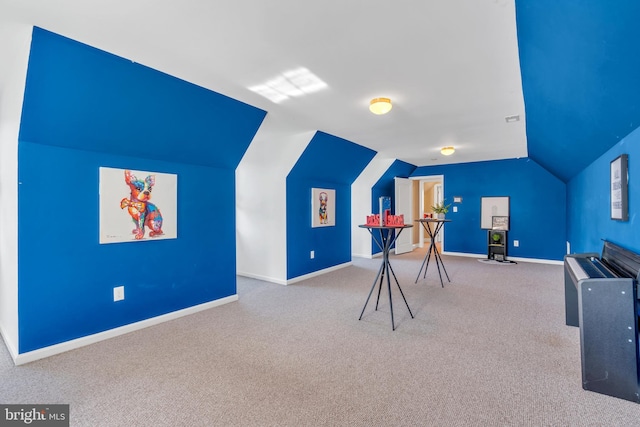 game room with carpet floors, baseboards, and vaulted ceiling