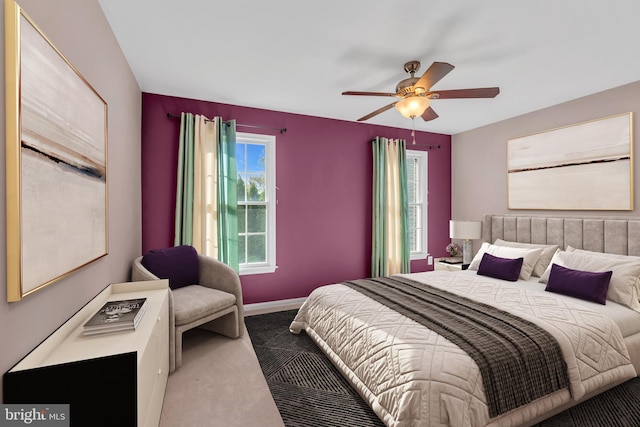 bedroom with carpet floors, a ceiling fan, and baseboards
