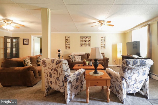 carpeted living area featuring crown molding and ceiling fan
