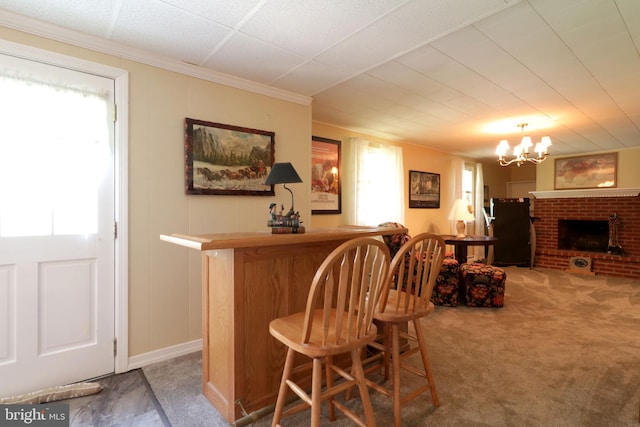bar with crown molding, a dry bar, carpet flooring, and a notable chandelier