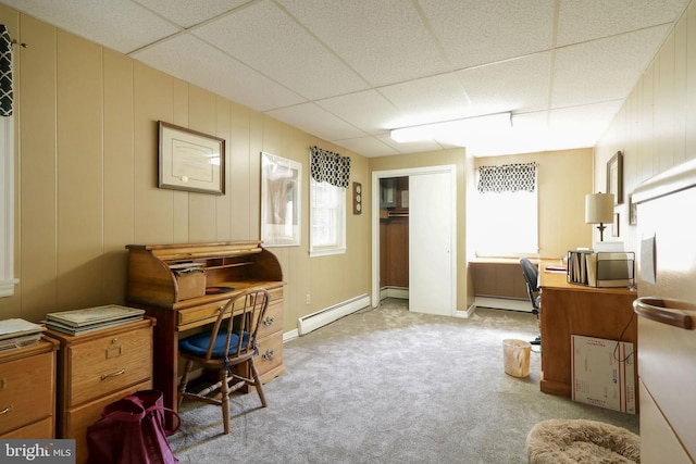 office area featuring light colored carpet, a paneled ceiling, baseboard heating, baseboards, and a baseboard heating unit