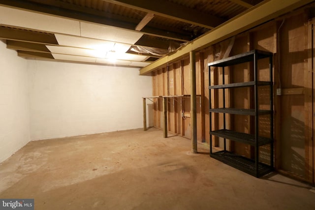below grade area with concrete block wall