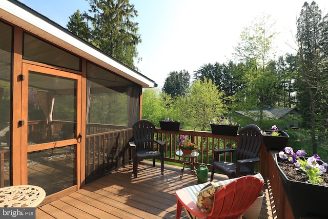 deck with a sunroom