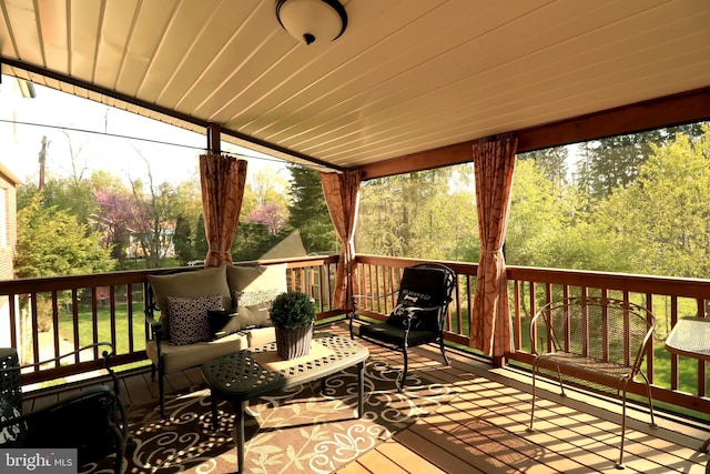 wooden terrace with outdoor lounge area