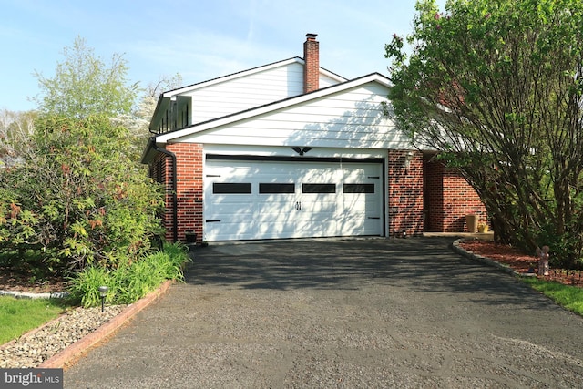 garage featuring driveway