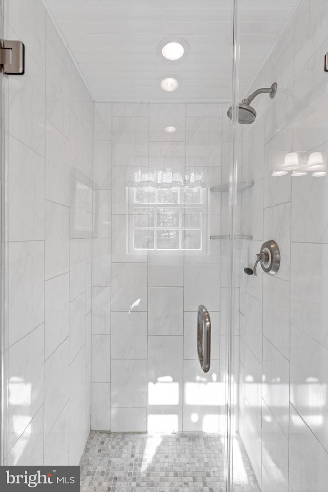 full bathroom featuring a shower stall