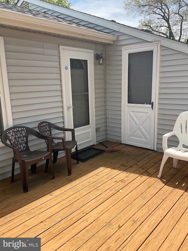 wooden deck featuring outdoor dining space