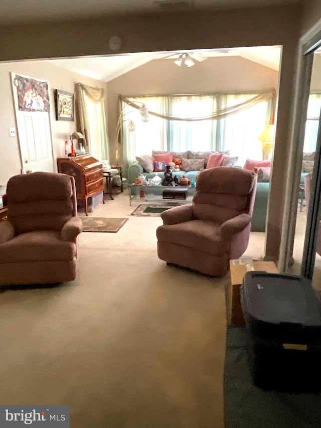 living room with carpet flooring and a ceiling fan