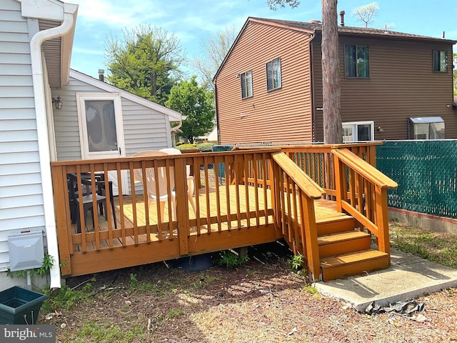 wooden deck featuring fence