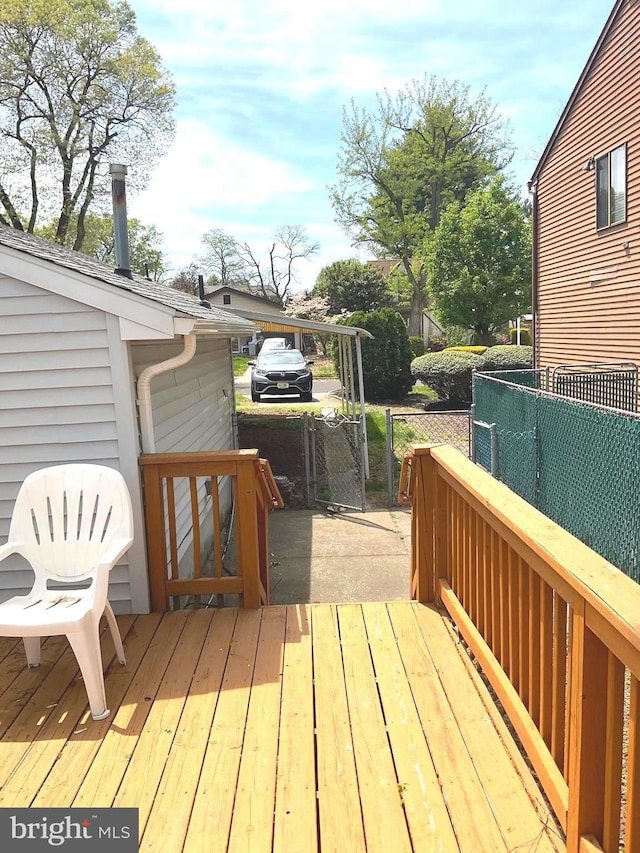wooden deck with fence and a gate