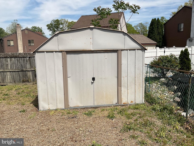 view of shed with a fenced backyard