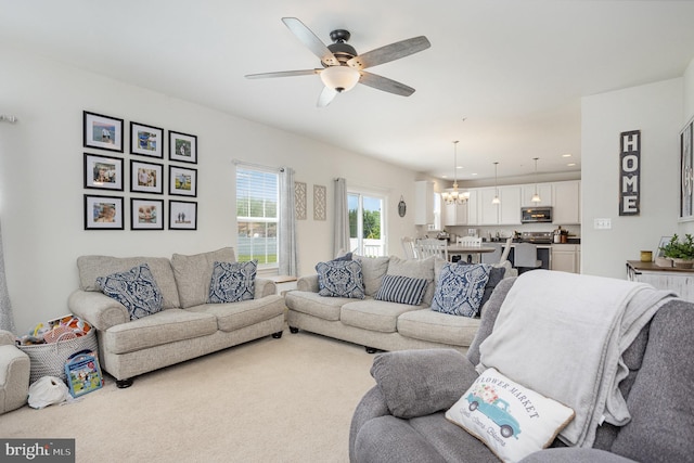 489 Beards Hill Rd, Aberdeen, MD 21001 - living area featuring a ceiling fan and a chandelier