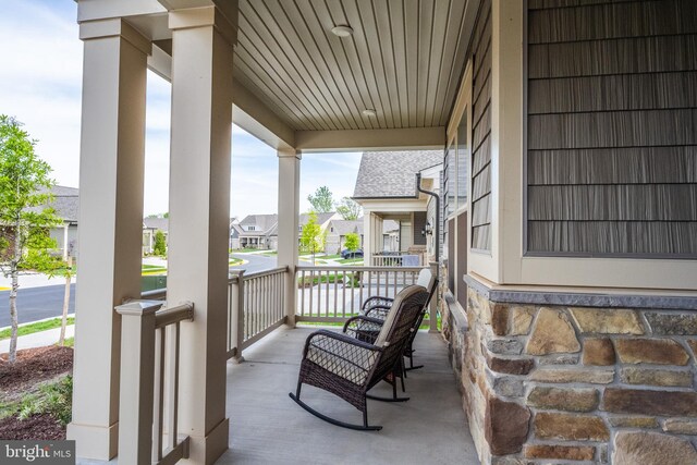 view of patio / terrace with a porch and a residential view