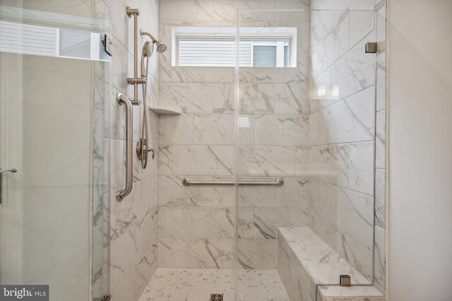 bathroom with a shower stall