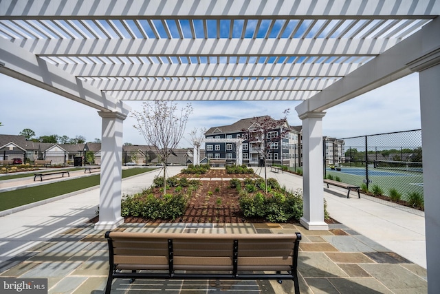 exterior space featuring fence and a pergola