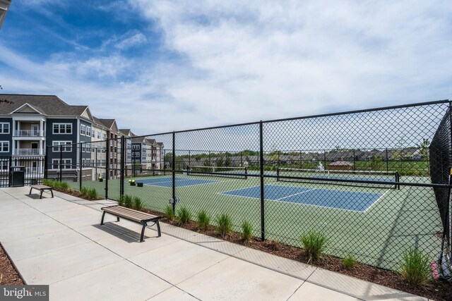 view of sport court with fence
