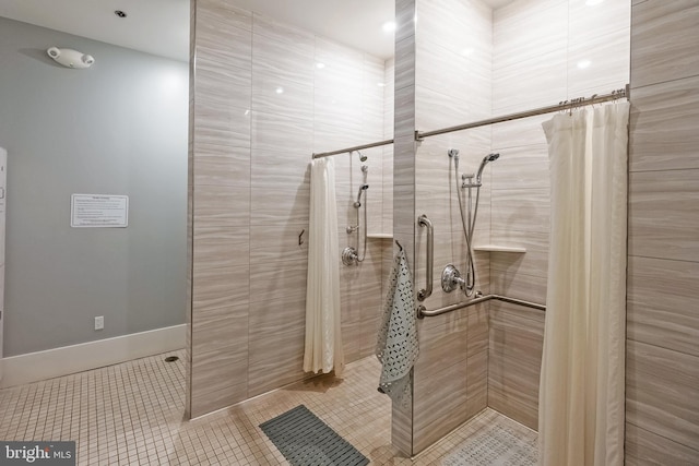 bathroom featuring recessed lighting, tile patterned floors, and a tile shower