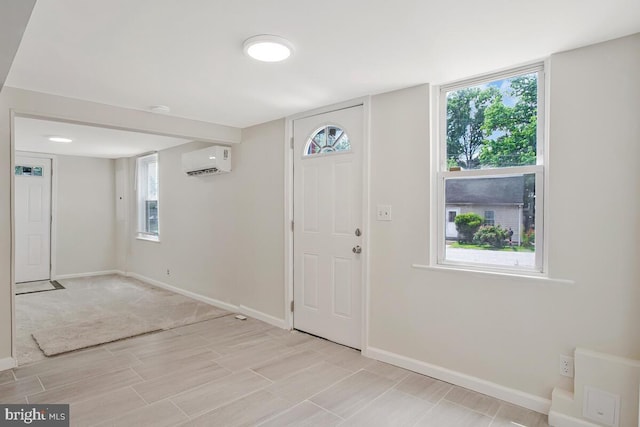 5018 Quimby Ave, Beltsville, MD 20705 - entryway with an AC wall unit, baseboards, and light wood-style flooring