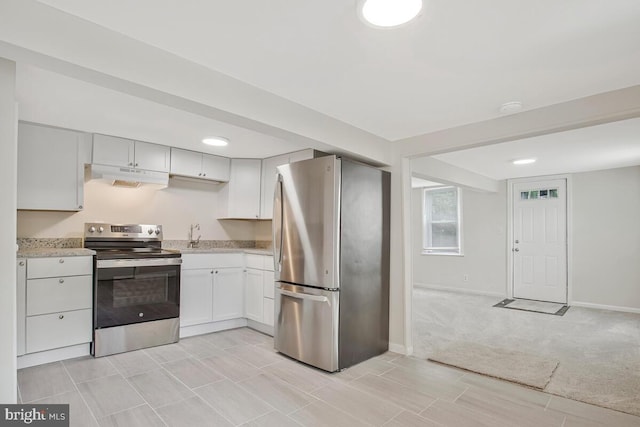 5018 Quimby Ave, Beltsville, MD 20705 - kitchen featuring stainless steel appliances, under cabinet range hood, baseboards, light stone countertops, and white cabinets
