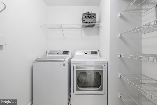 laundry room featuring washing machine and dryer