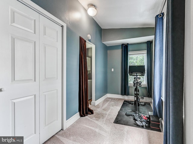 2122 E Lombard St E, Baltimore, MD 21231 - workout room with light carpet and baseboards