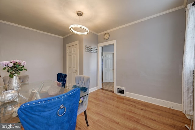 322-324 Washington Ave, Laurel Springs, NJ 08021 - dining area featuring crown molding, baseboards, visible vents, and light wood finished floors
