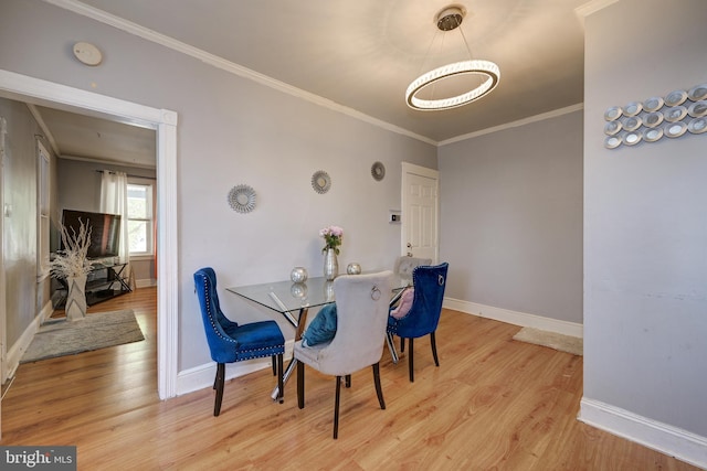 322-324 Washington Ave, Laurel Springs, NJ 08021 - dining space featuring crown molding, baseboards, and wood finished floors