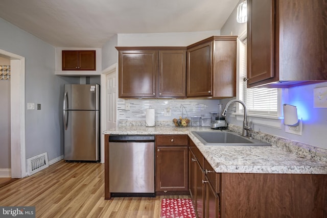 322-324 Washington Ave, Laurel Springs, NJ 08021 - kitchen with a sink, light countertops, light wood-style flooring, stainless steel appliances, and visible vents