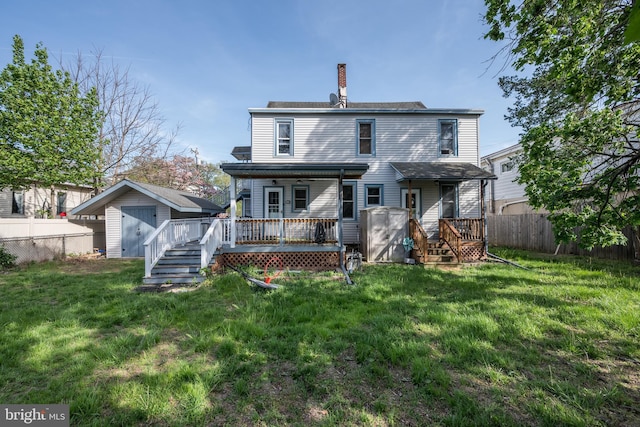 322-324 Washington Ave, Laurel Springs, NJ 08021 - rear view of property featuring a deck, a shed, a fenced backyard, an outbuilding, and a chimney