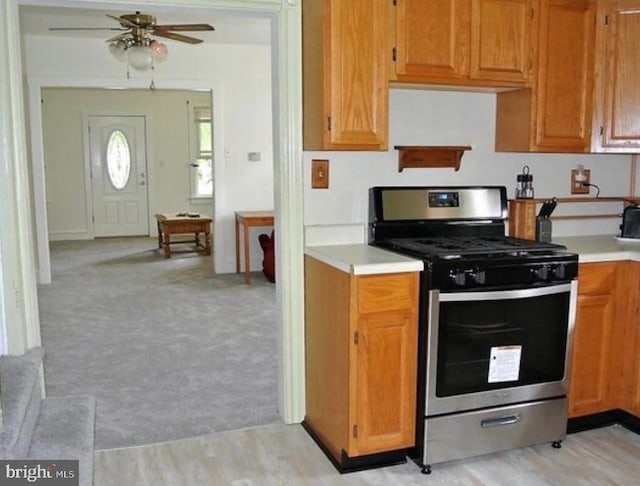 322-324 Washington Ave, Laurel Springs, NJ 08021 - kitchen with ceiling fan, light carpet, light wood-style floors, light countertops, and stainless steel range with gas cooktop