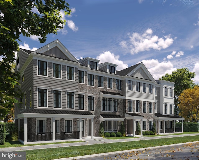 townhome / multi-family property with stone siding
