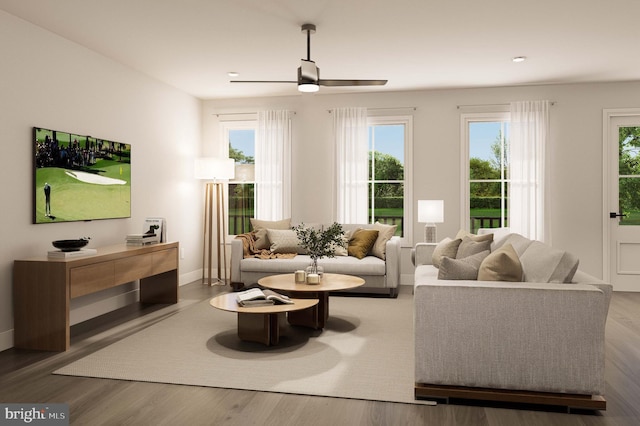 living area with baseboards, recessed lighting, ceiling fan, and wood finished floors
